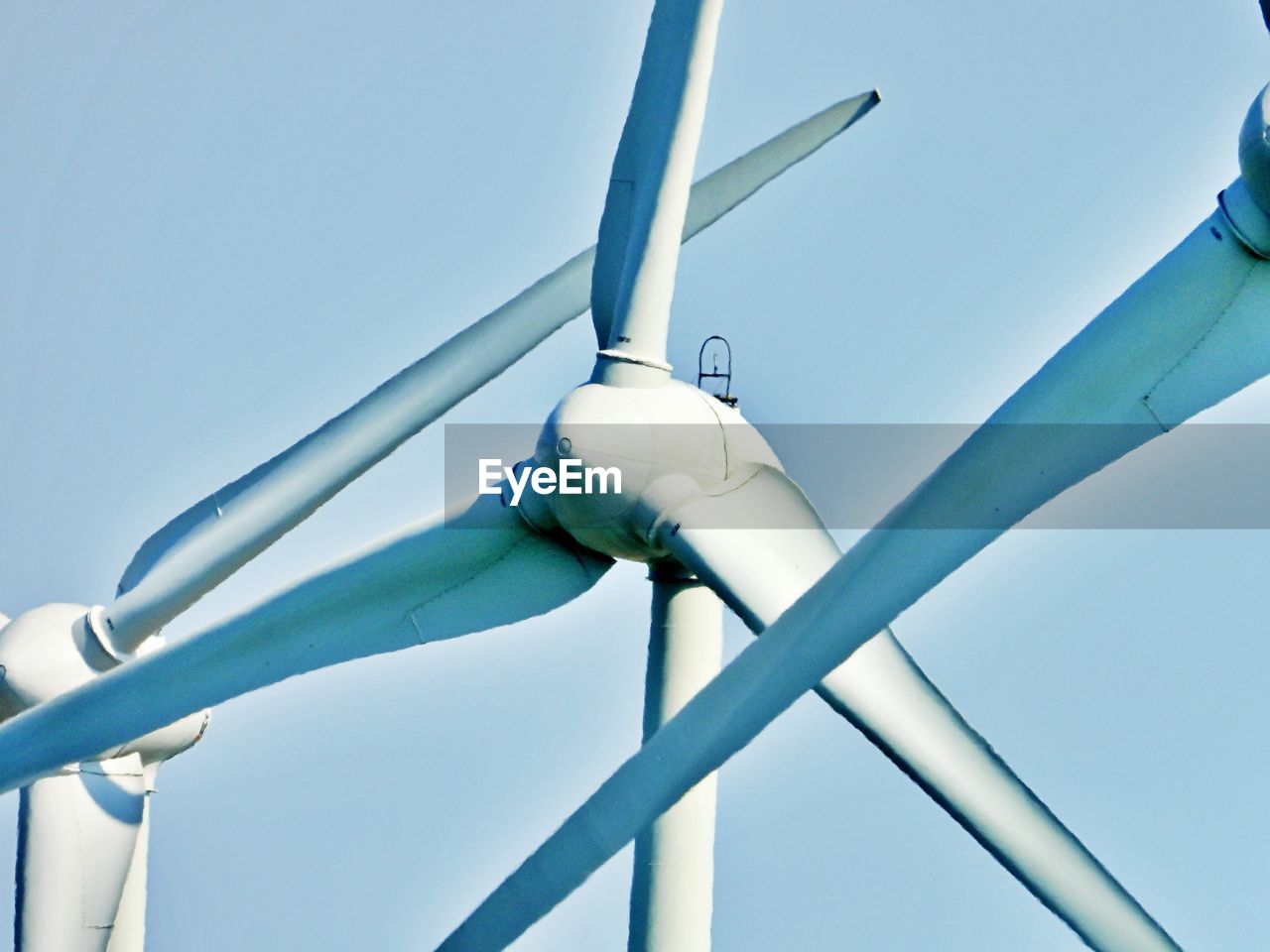 Low angle view of windmill against sky