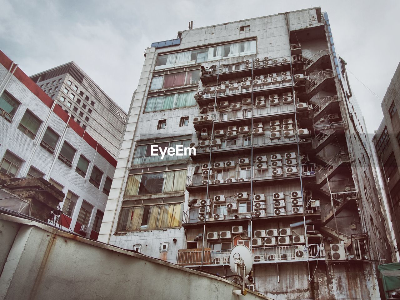 Low angle view of buildings in city against sky