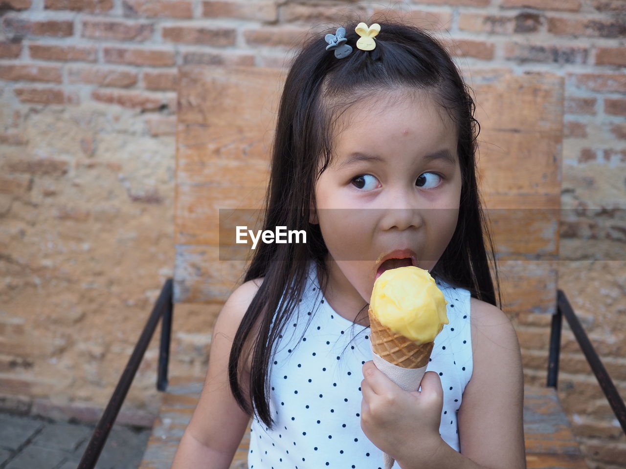 Portrait of cute girl eating food