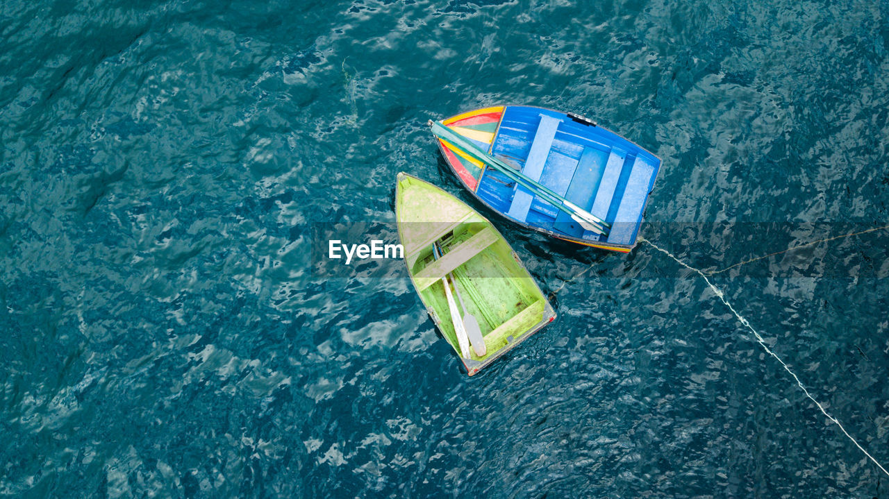 High angle view of boats floating on lake