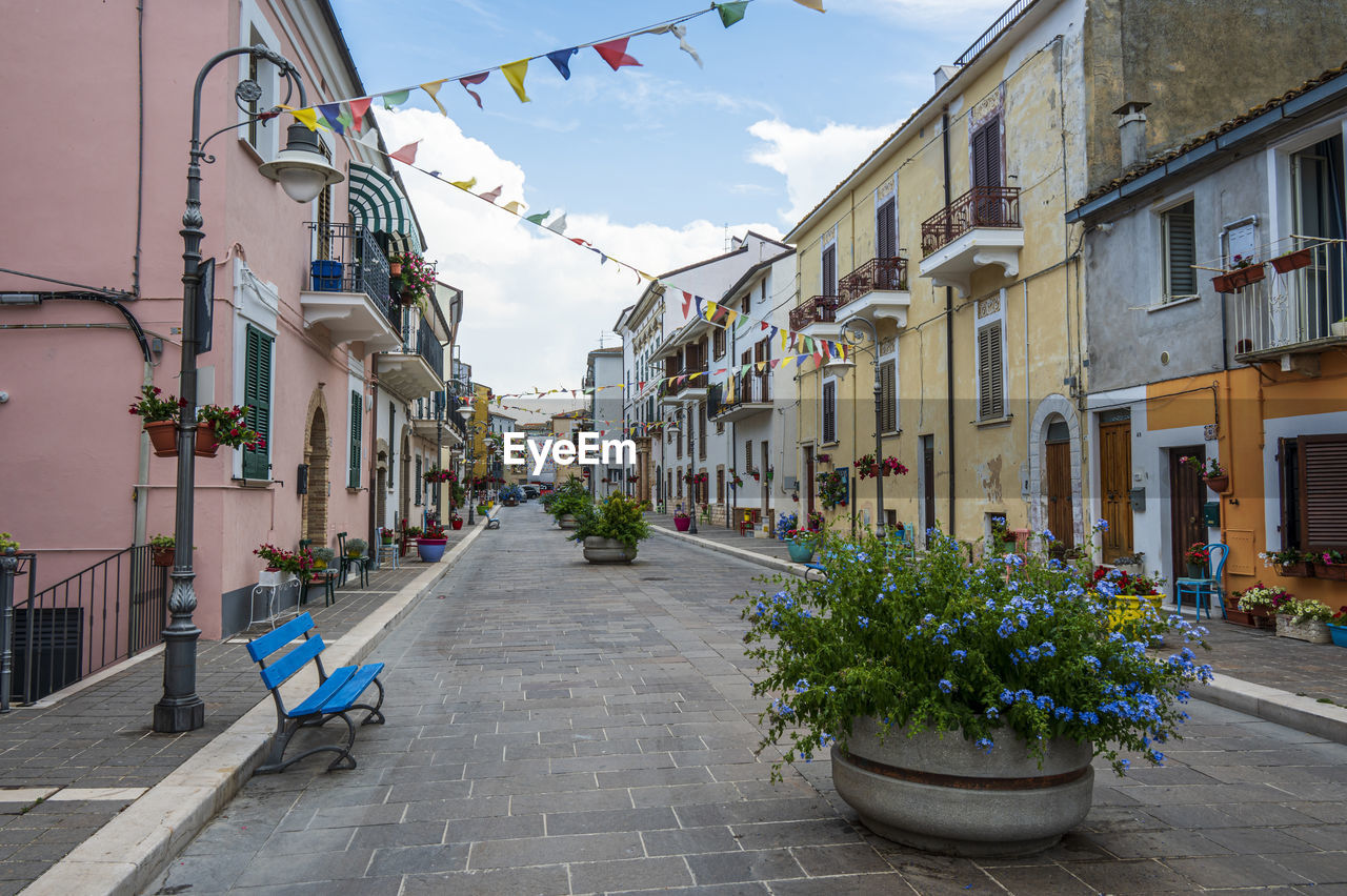 The beautiful main street of san vito chietino with colored flowers and facades