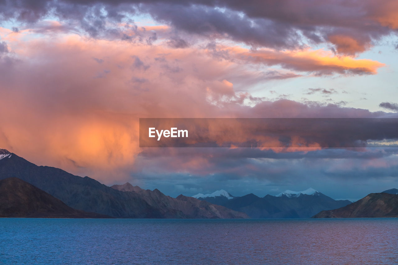 Scenic view of mountains against sky during sunset