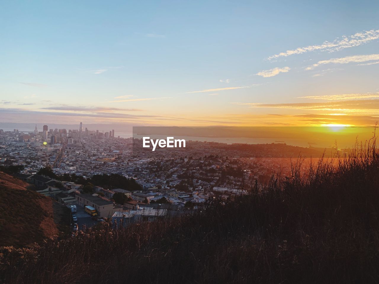 High angle view of buildings against sky during sunset