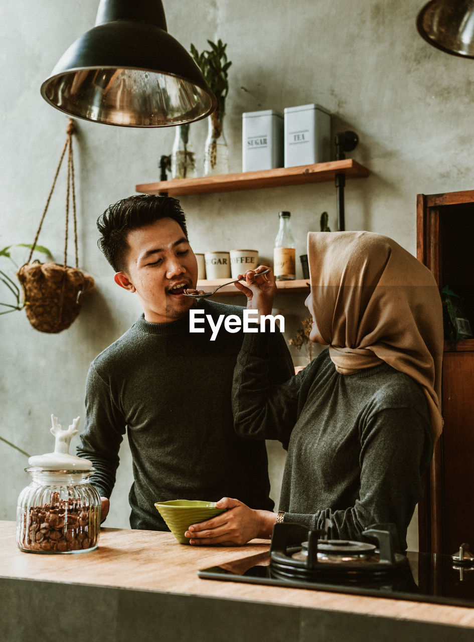 PEOPLE SITTING AT TABLE