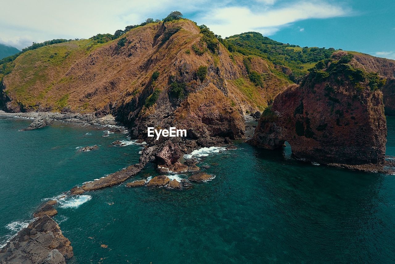 SCENIC VIEW OF SEA BY CLIFF