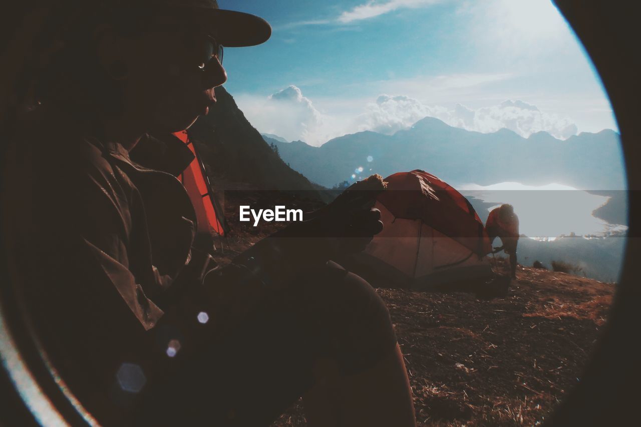 WOMAN ON MOUNTAIN LANDSCAPE