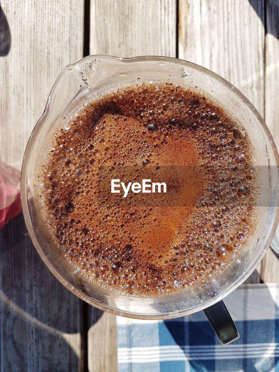 Directly above shot of coffee on wooden table