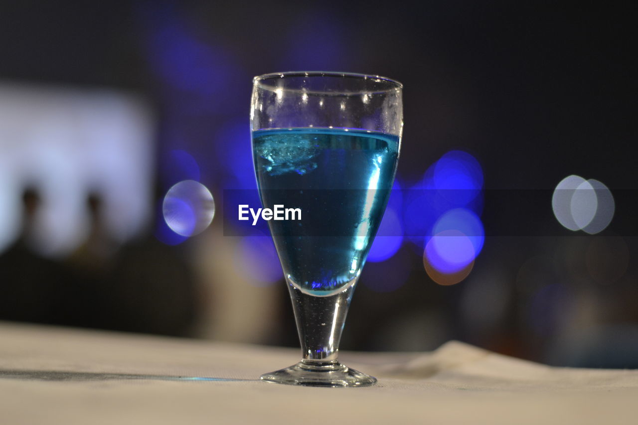 Close-up of blue drink on table
