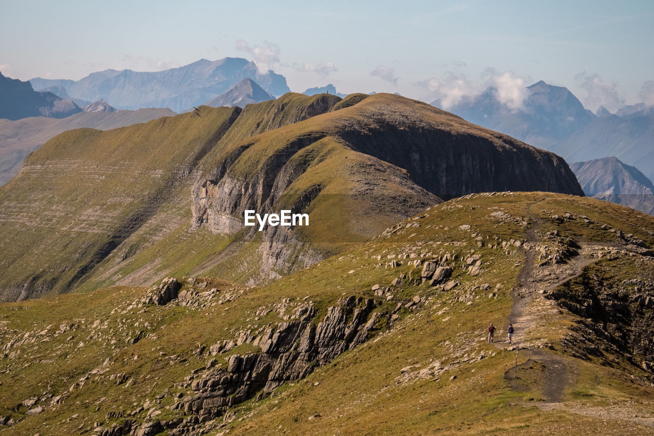 View of dramatic landscape against mountain range