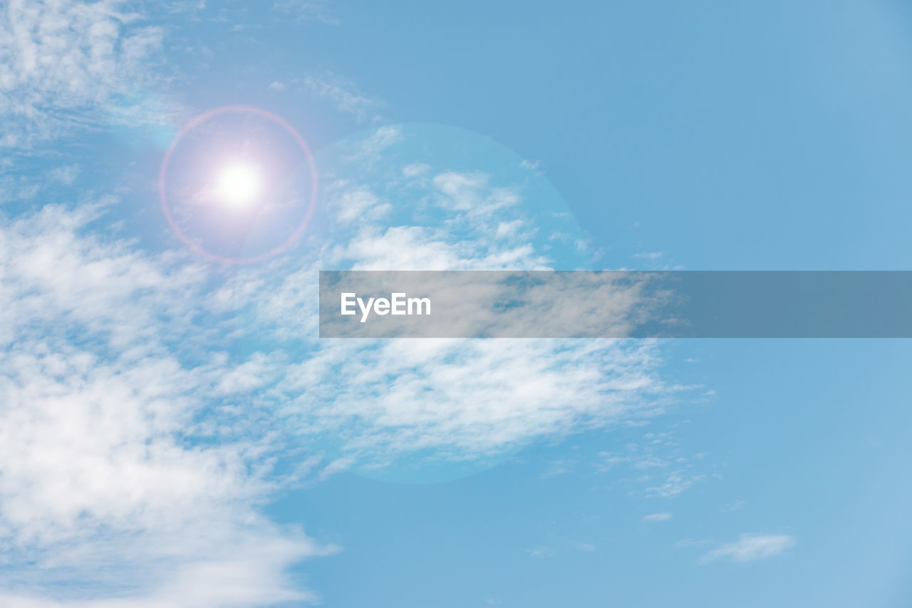 LOW ANGLE VIEW OF BRIGHT SUN AGAINST SKY