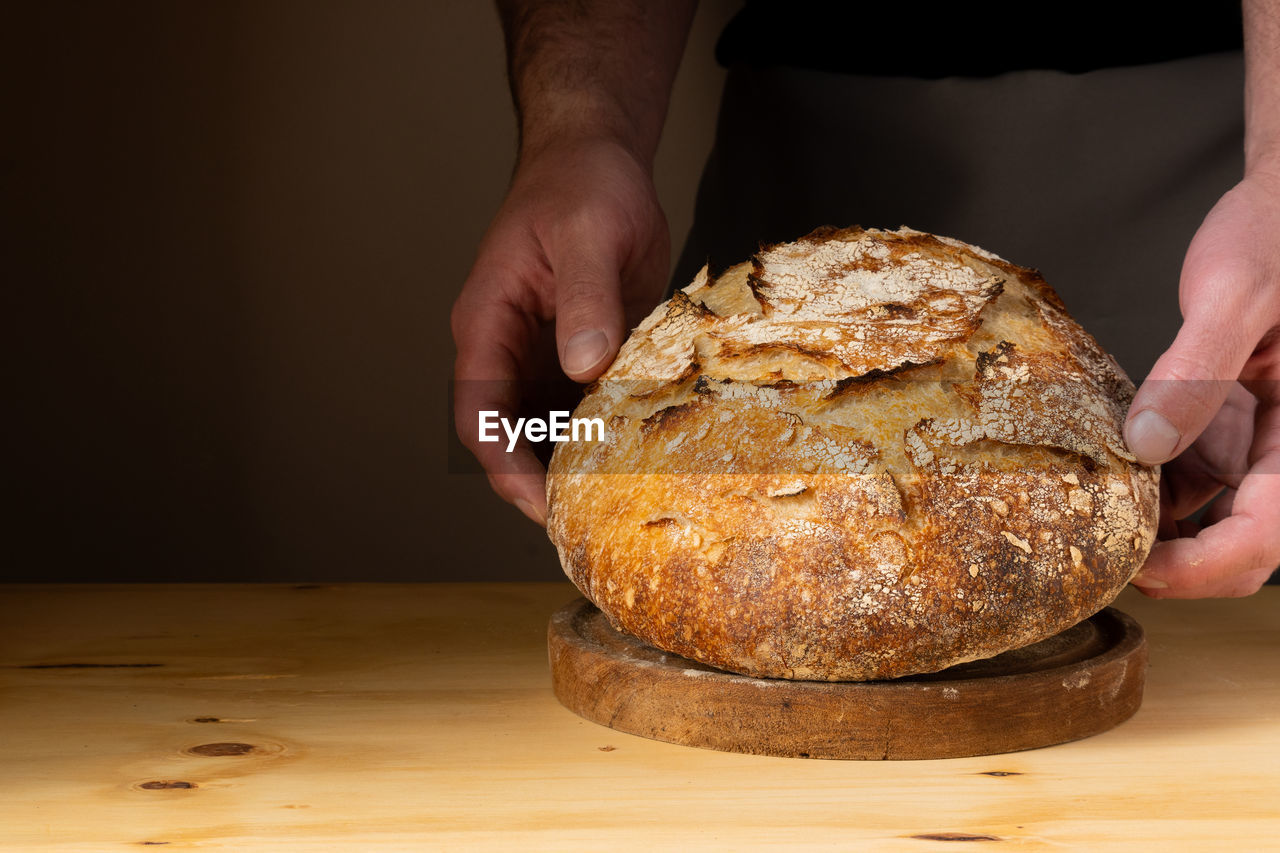 midsection of person preparing food on table