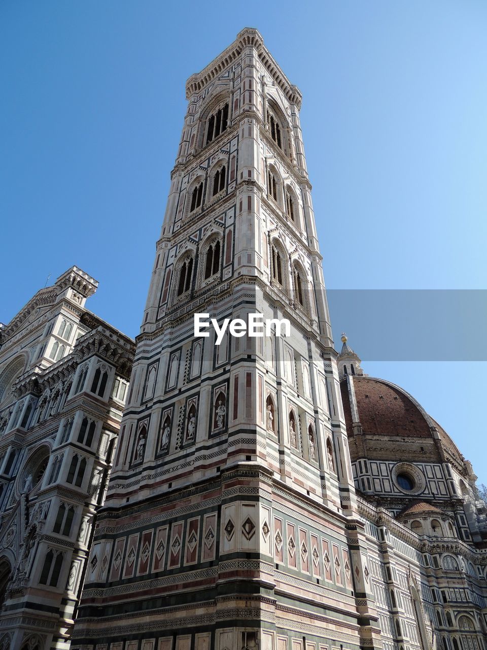 Low angle view of historic building against clear blue sky