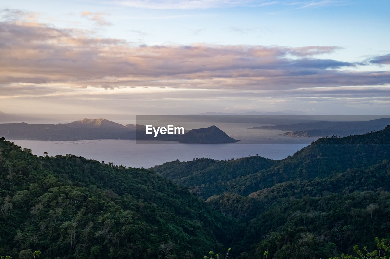 Scenic view of mountains against sky at sunset