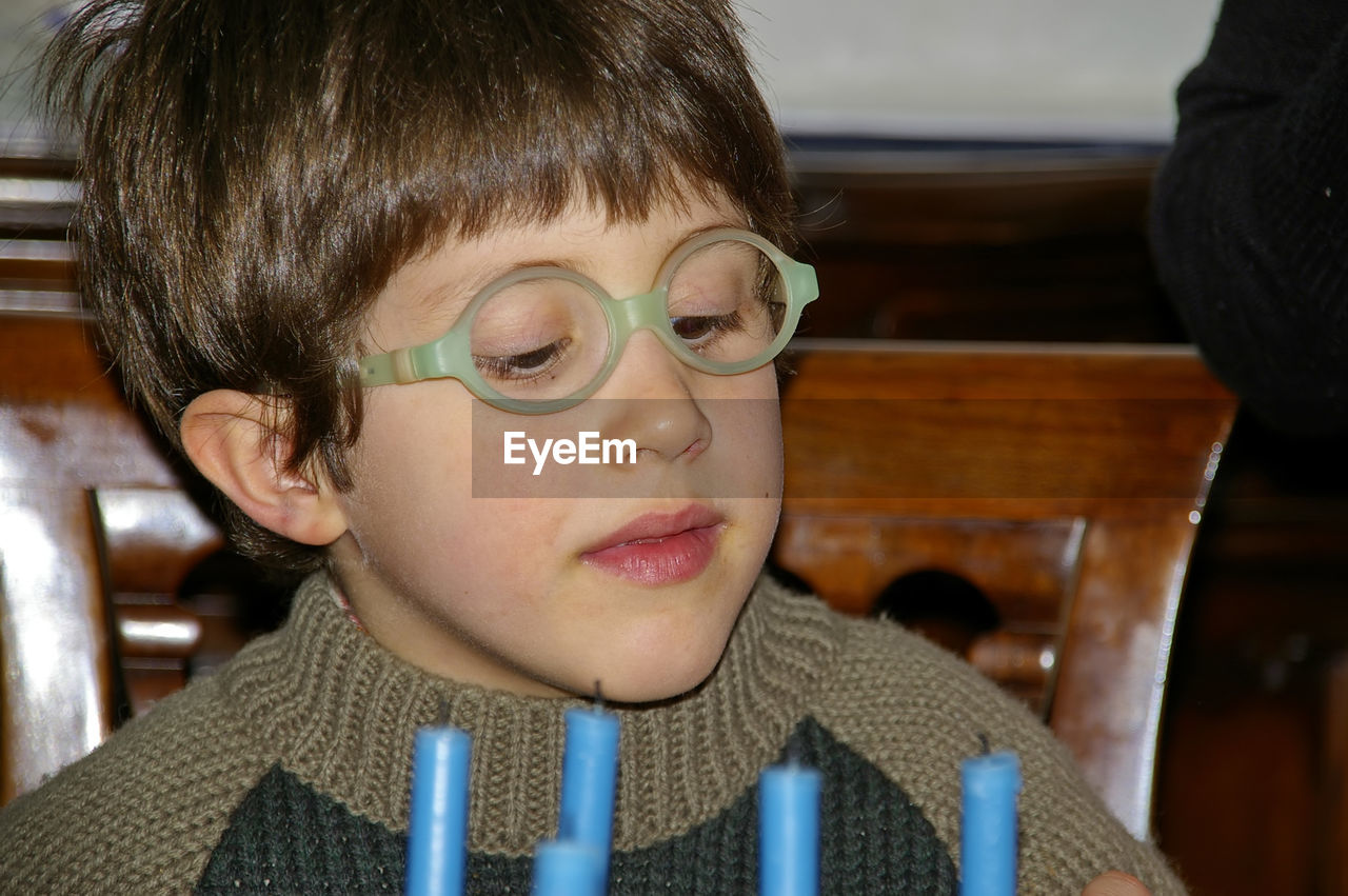 PORTRAIT OF BOY WITH EYEGLASSES