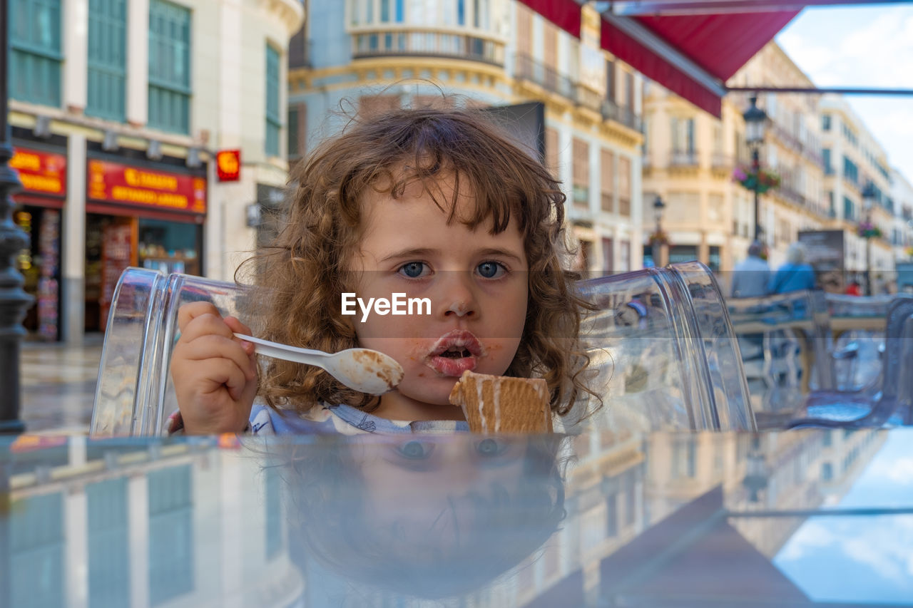 Portrait of cute girl holding ice cream