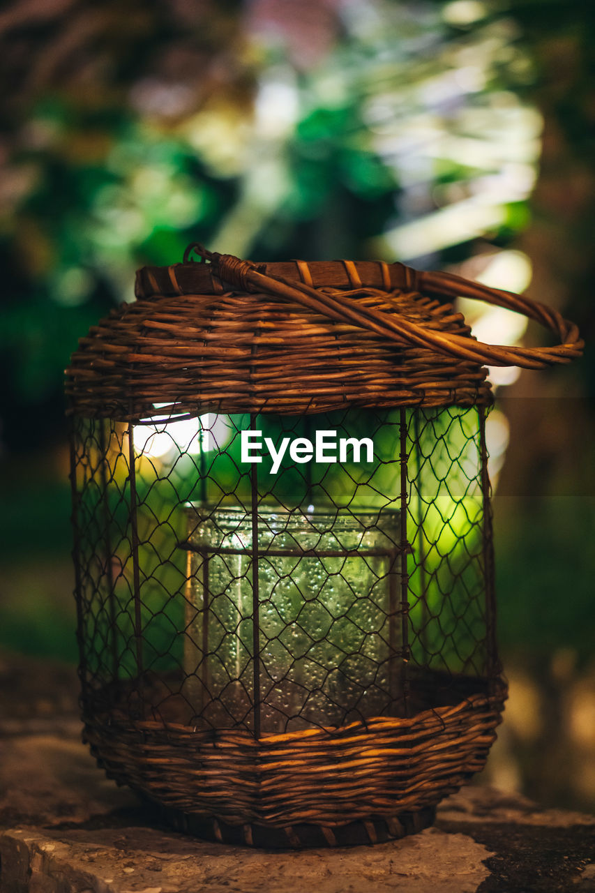 CLOSE-UP OF BASKET ON FIELD