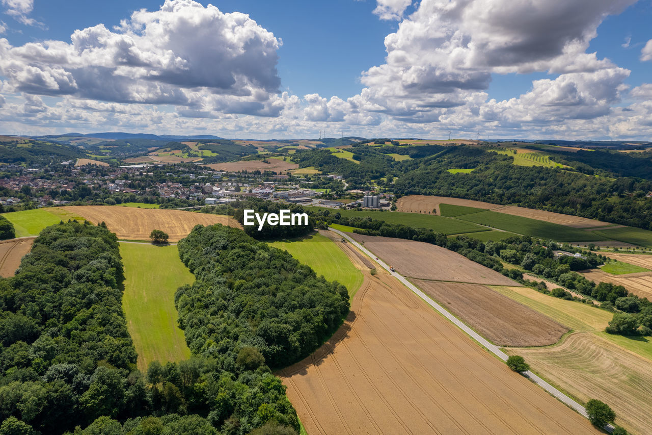 PANORAMIC VIEW OF AGRICULTURAL FIELD AGAINST SKY