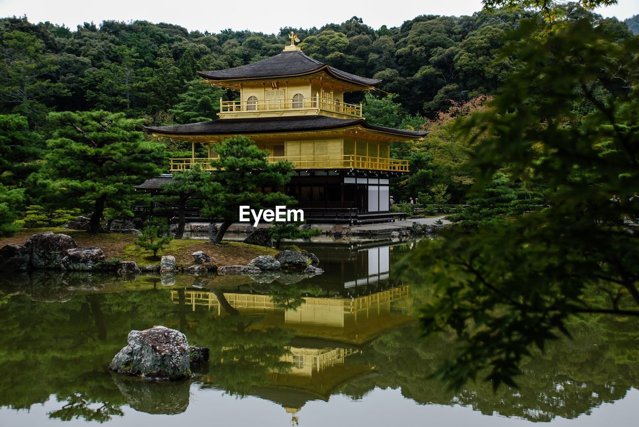 REFLECTION OF BUILDING ON LAKE