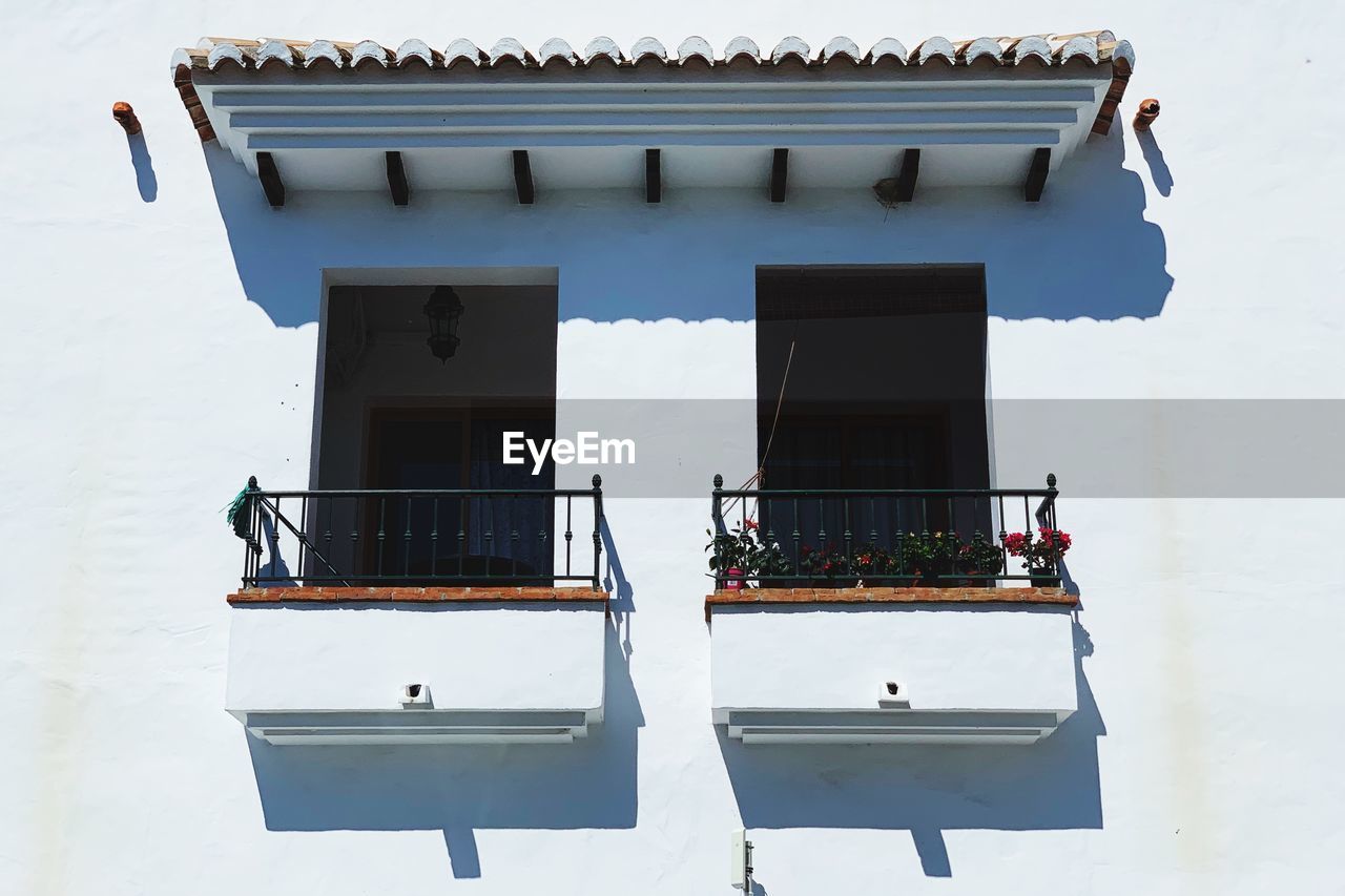 Low angle view of windows on house