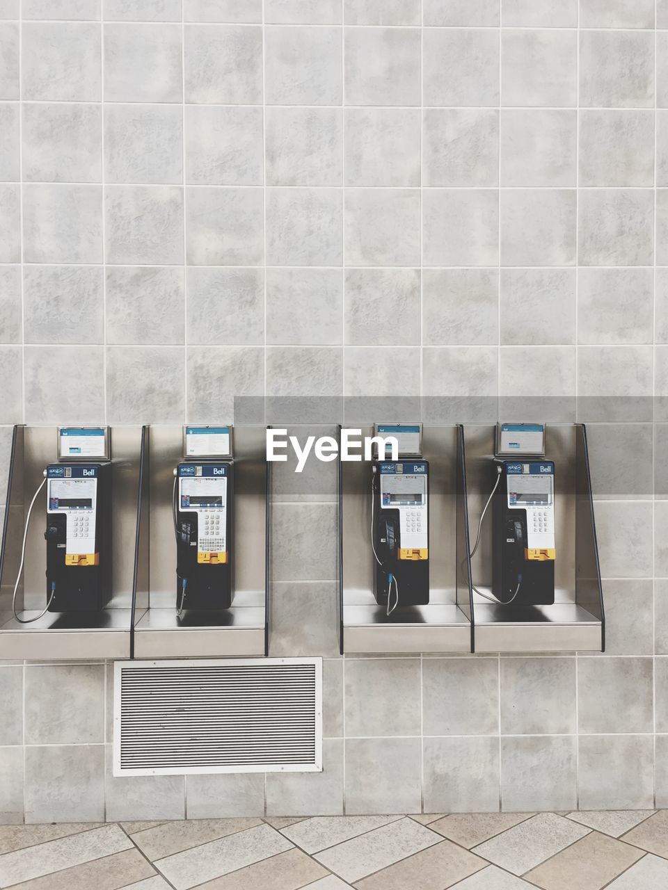 Pay phones mounted on wall