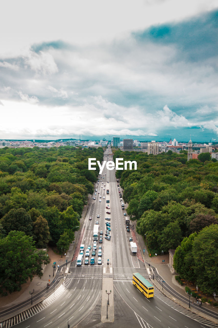 High angle view of traffic on road against cloudy sky