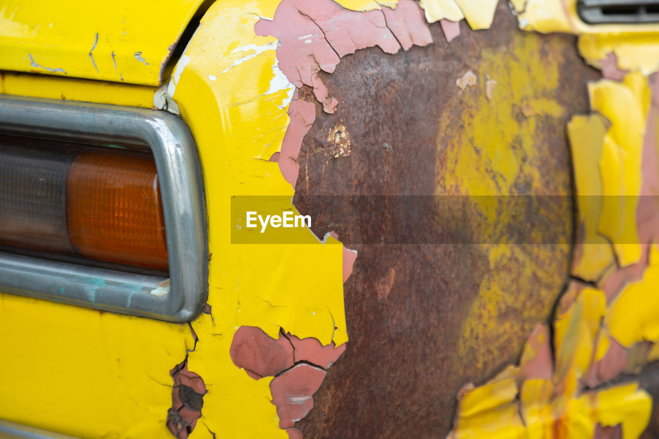 Close-up of yellow rusty metal