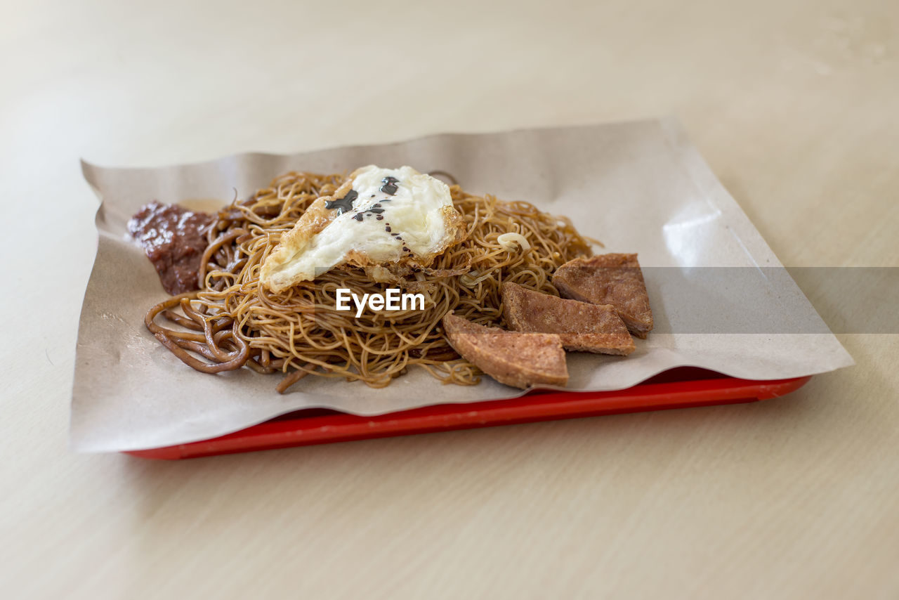 Close-up of noodles served in plate on table