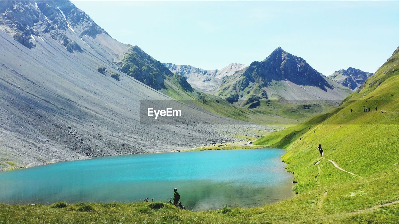 SCENIC VIEW OF RIVER AND MOUNTAINS