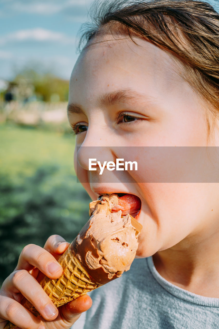 Close-up of woman eating ice cream