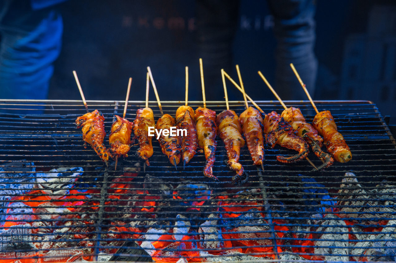 MEAT ON BARBECUE GRILL AT MARKET