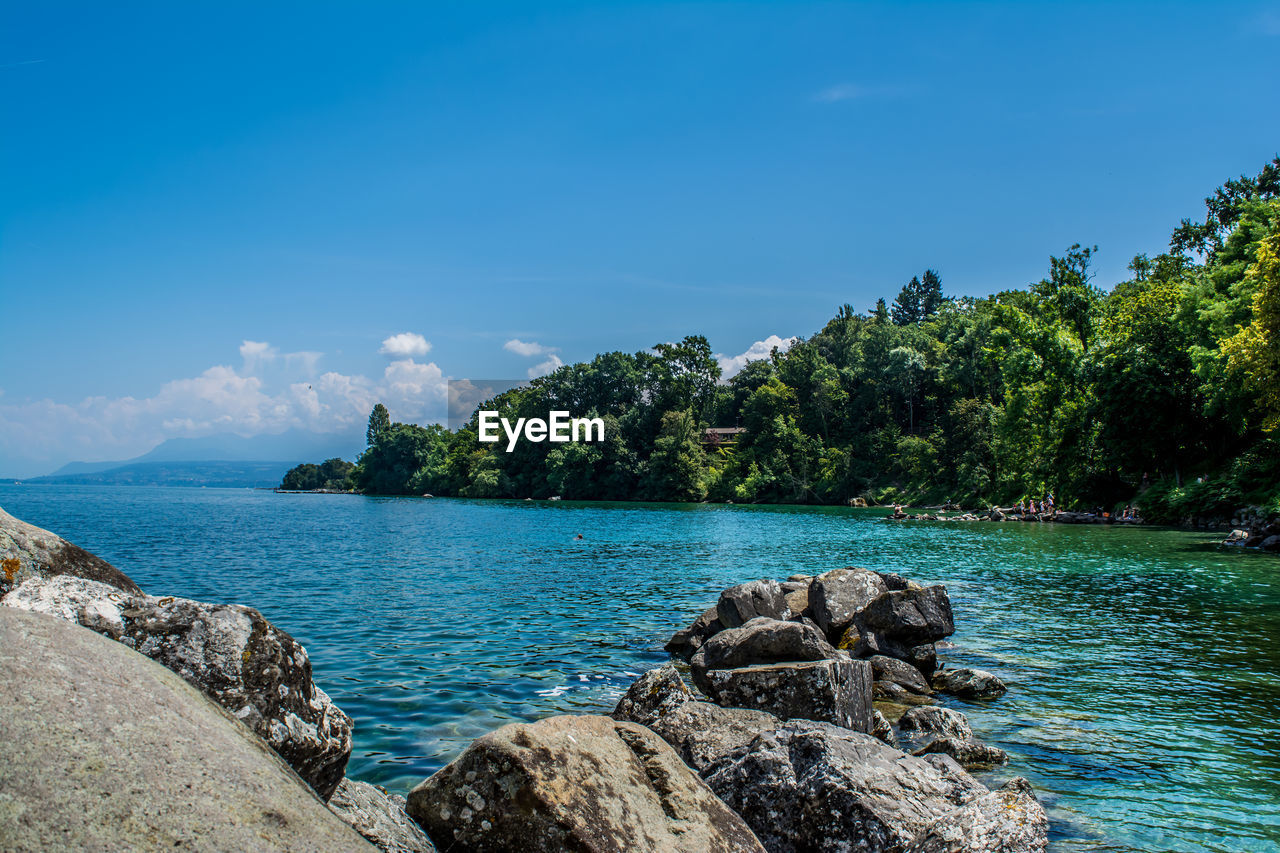 Scenic view of sea against blue sky