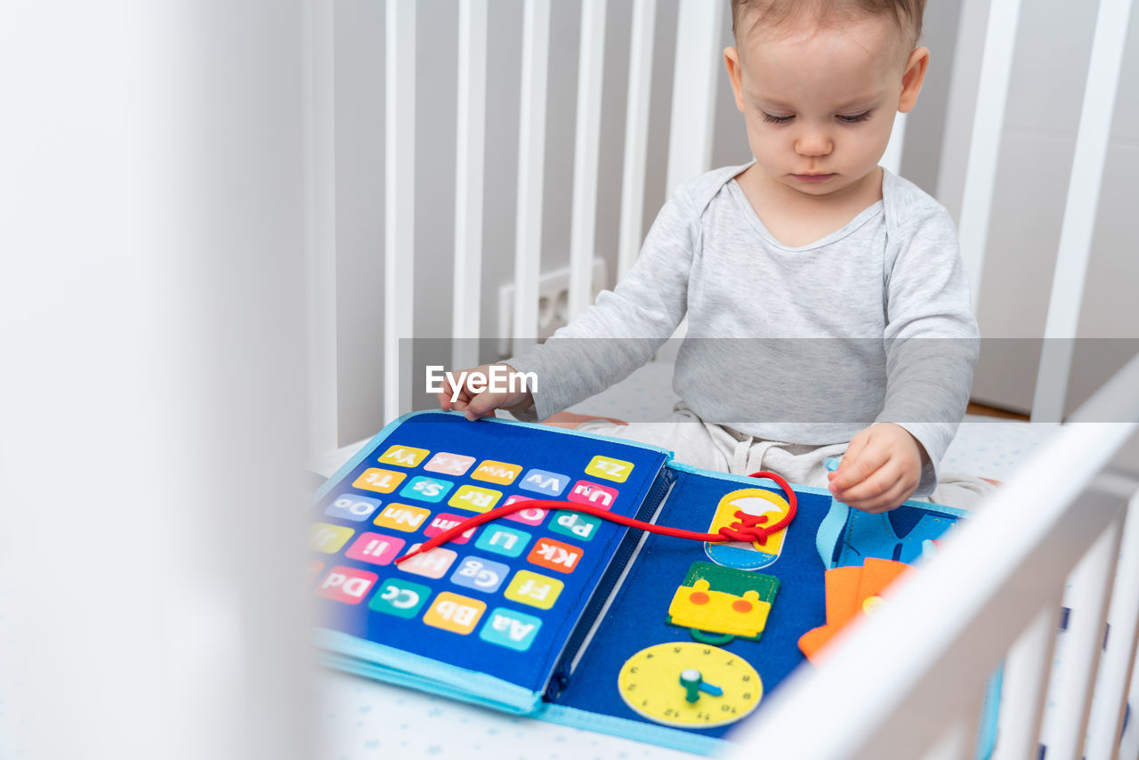 portrait of boy playing with toy blocks