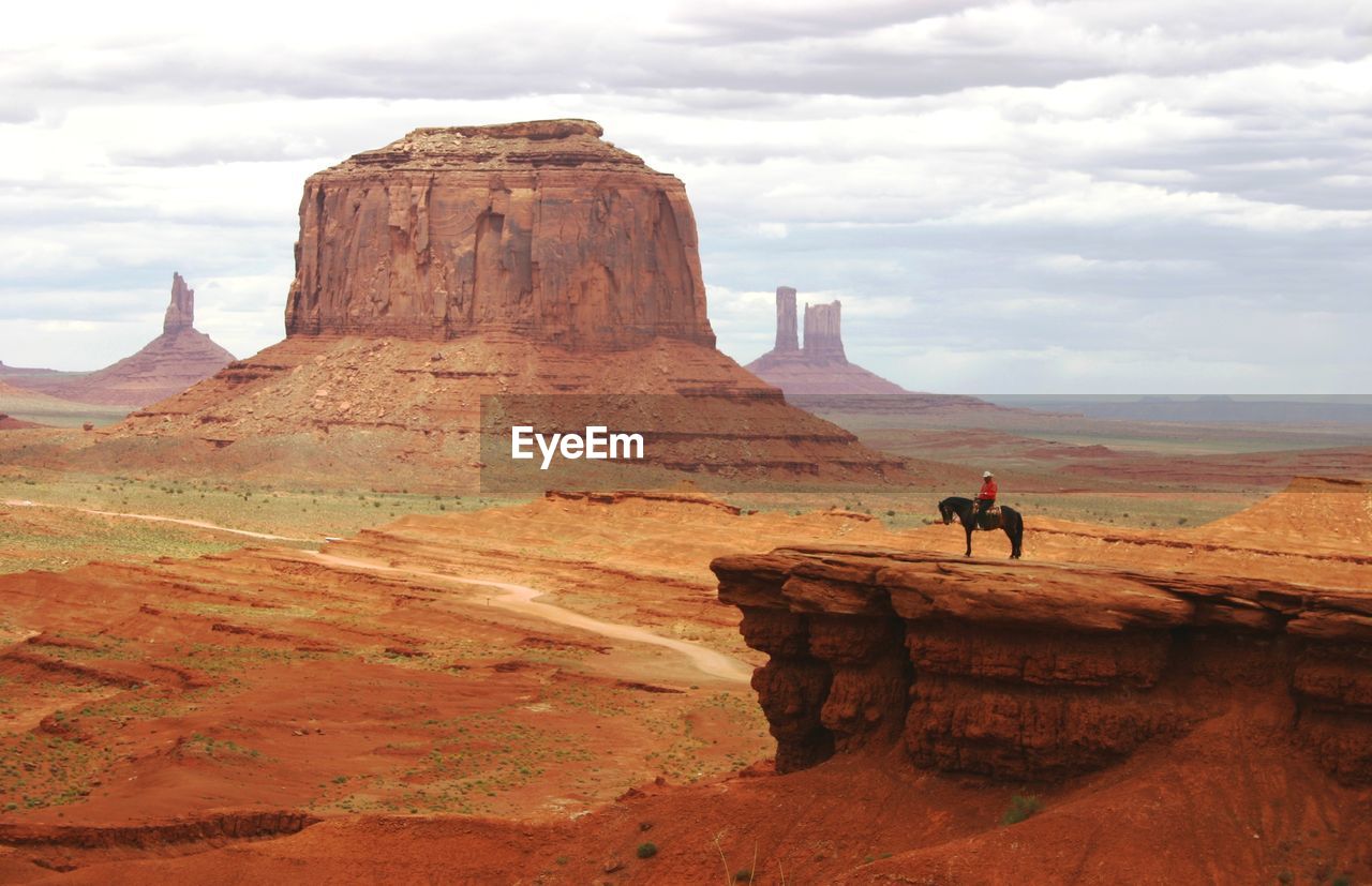 Lone cowboy in the monument valley