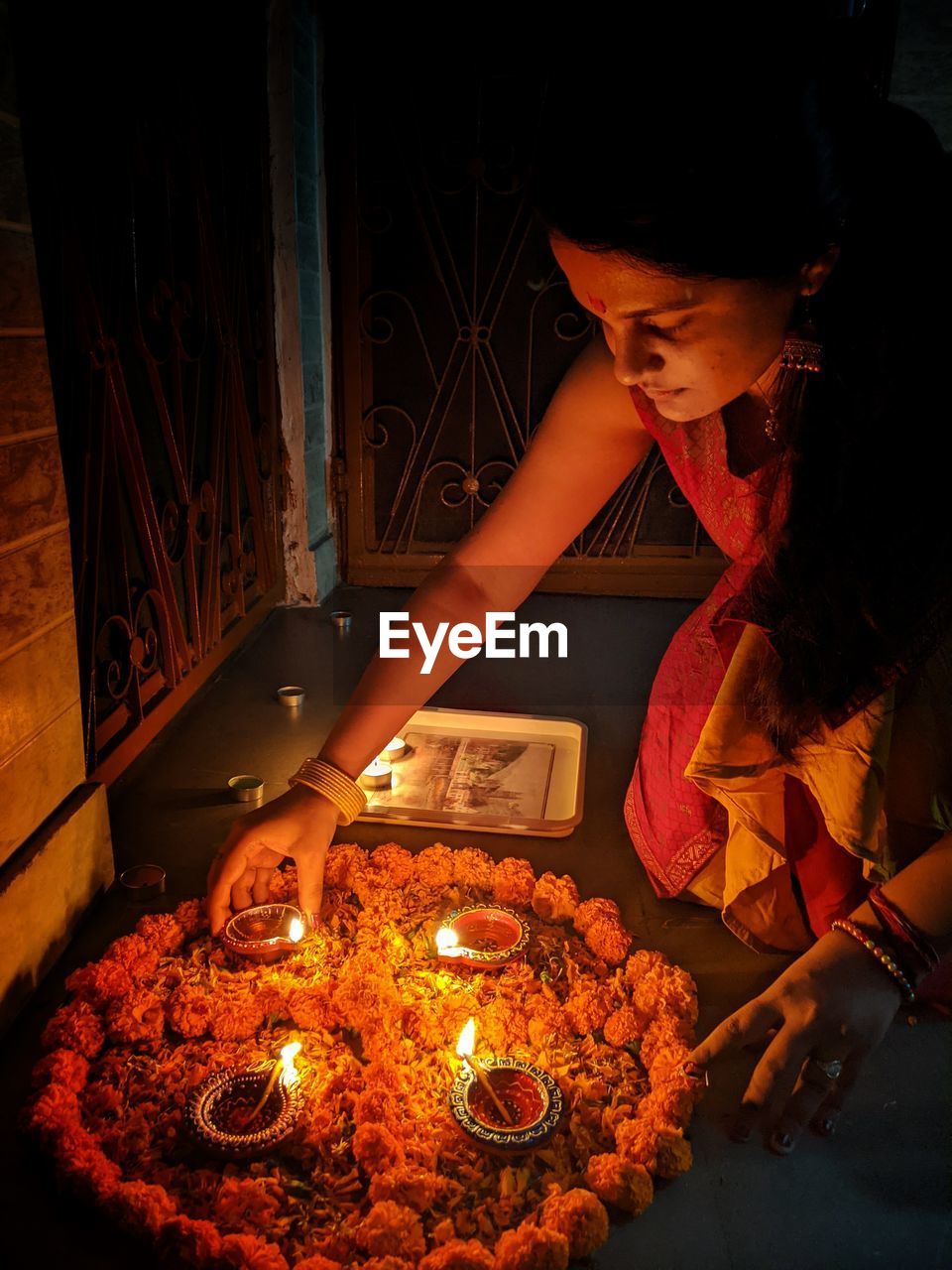 Young woman decorating at home