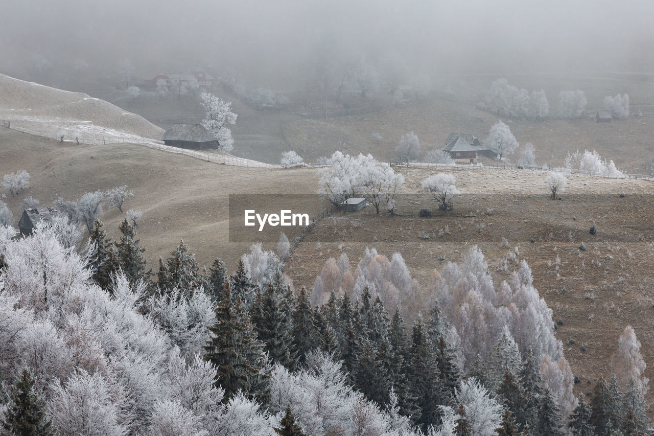 Scenic view of foggy mountains