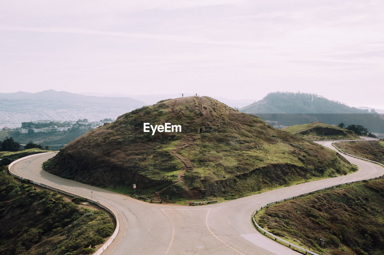 Mountain amidst road against sky