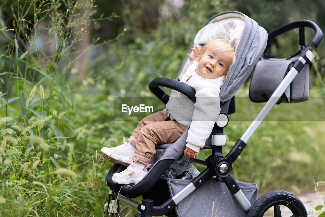 Portrait of smiling baby in stroller