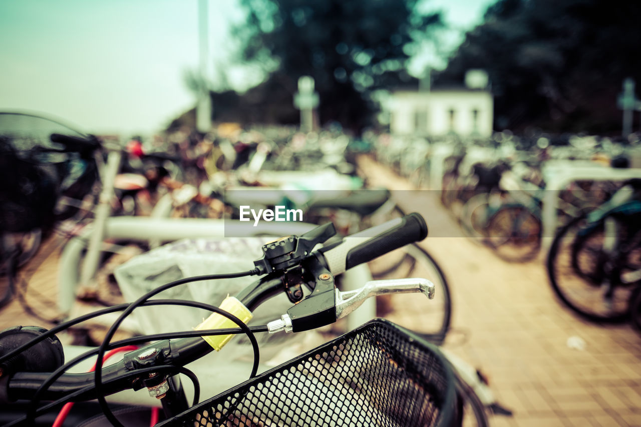 Close-up of bicycle on street in city