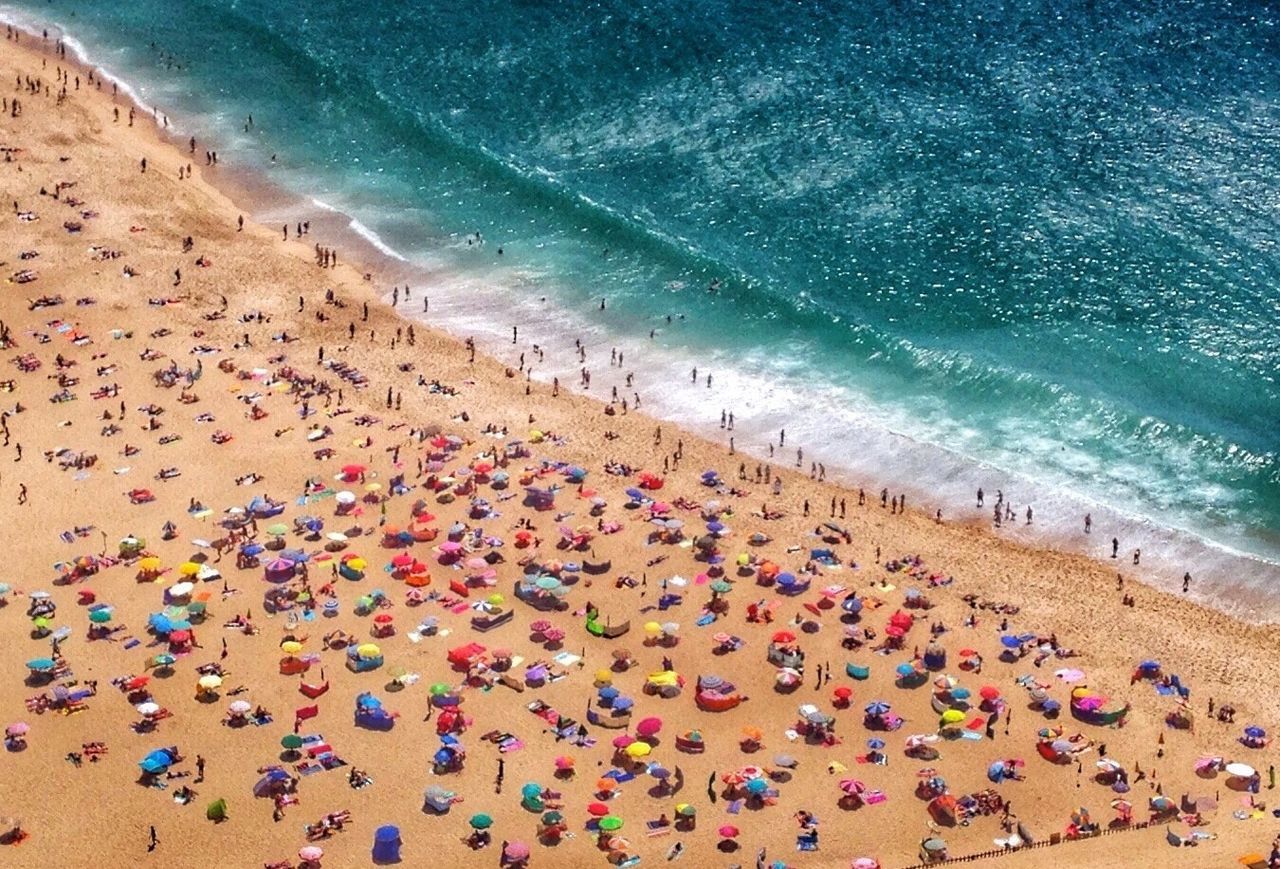 PEOPLE ENJOYING VACATION ON BEACH