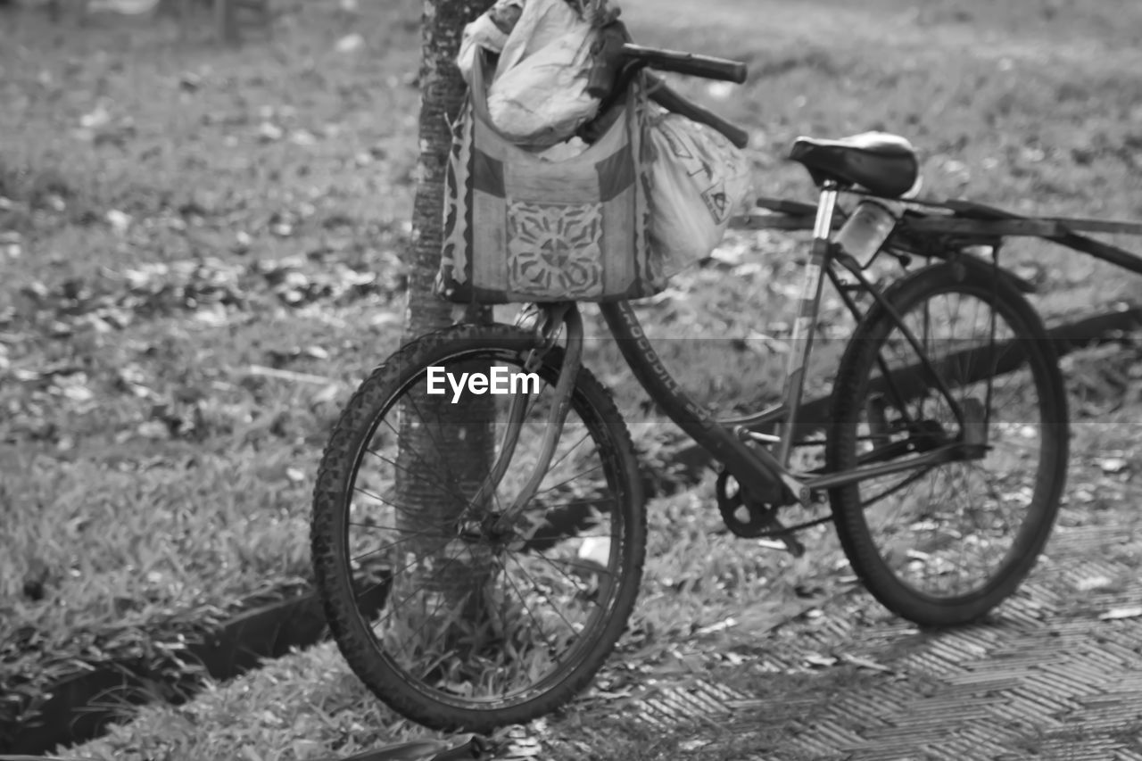 Bicycle parked on field