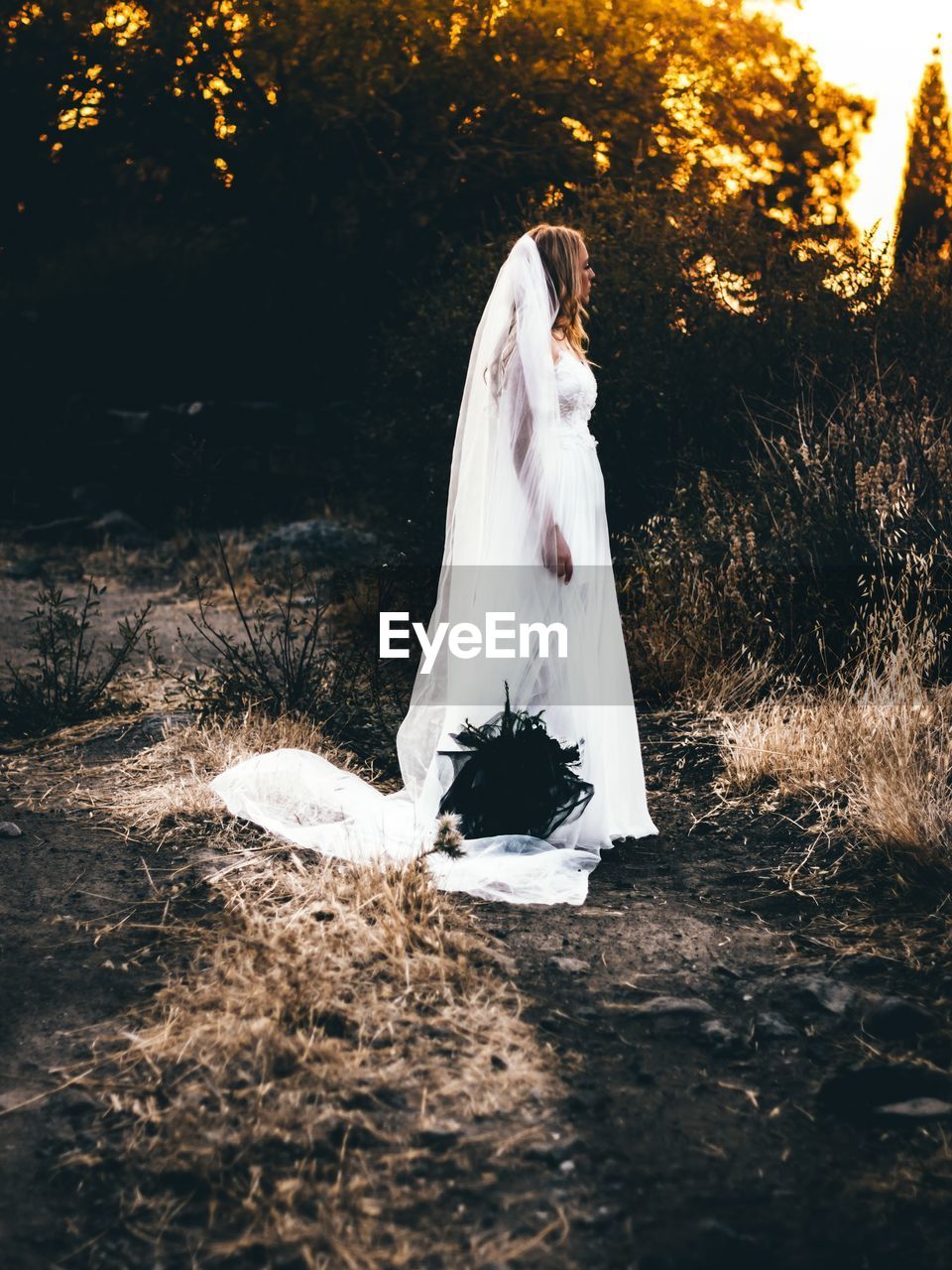 WOMAN STANDING ON FIELD