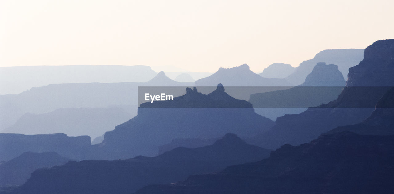 Scenic view of mountains against sky during sunset