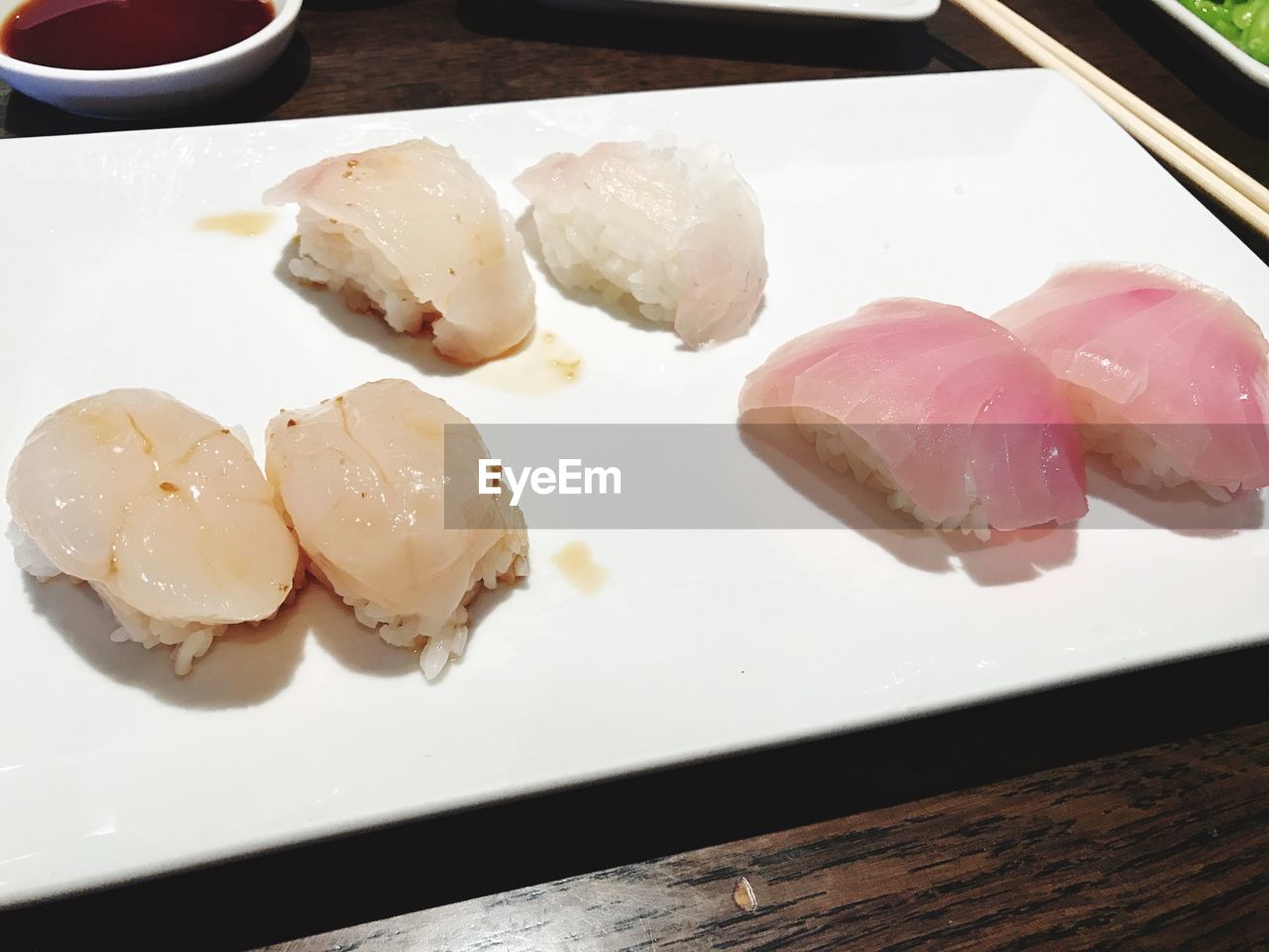 CLOSE-UP OF SUSHI ON TABLE