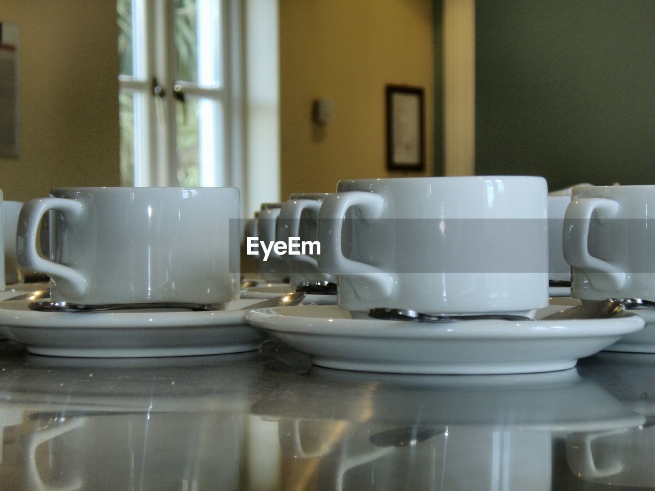 Tea cups arranged on table