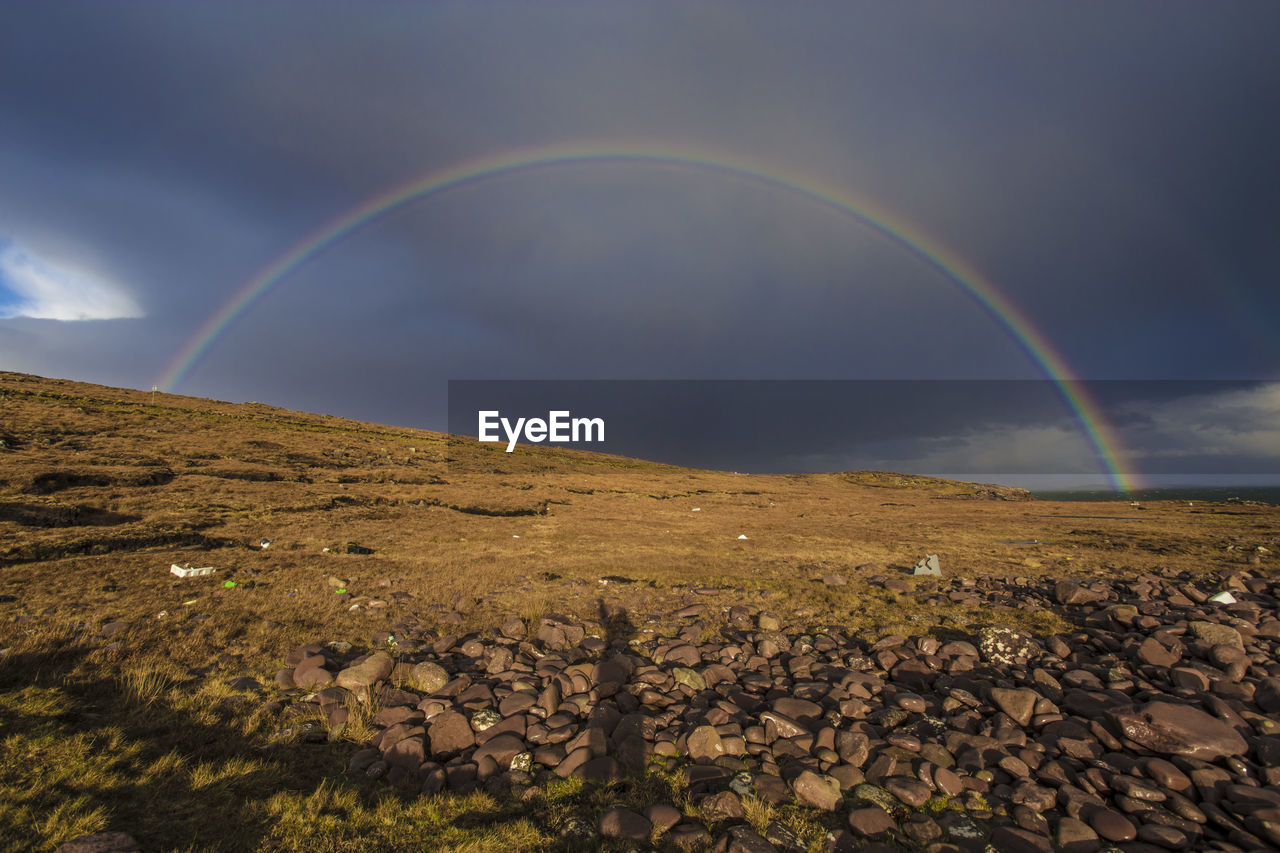 SCENIC VIEW OF RAINBOW IN SKY