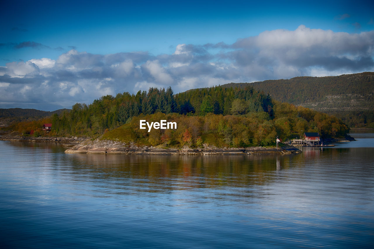 reflection, water, nature, tree, sky, lake, scenics - nature, cloud, mountain, beauty in nature, plant, body of water, morning, environment, dusk, land, landscape, forest, tranquility, no people, tranquil scene, reservoir, travel, wilderness, travel destinations, outdoors, nautical vessel, blue, non-urban scene, mountain range, day, pine tree, tourism, pinaceae