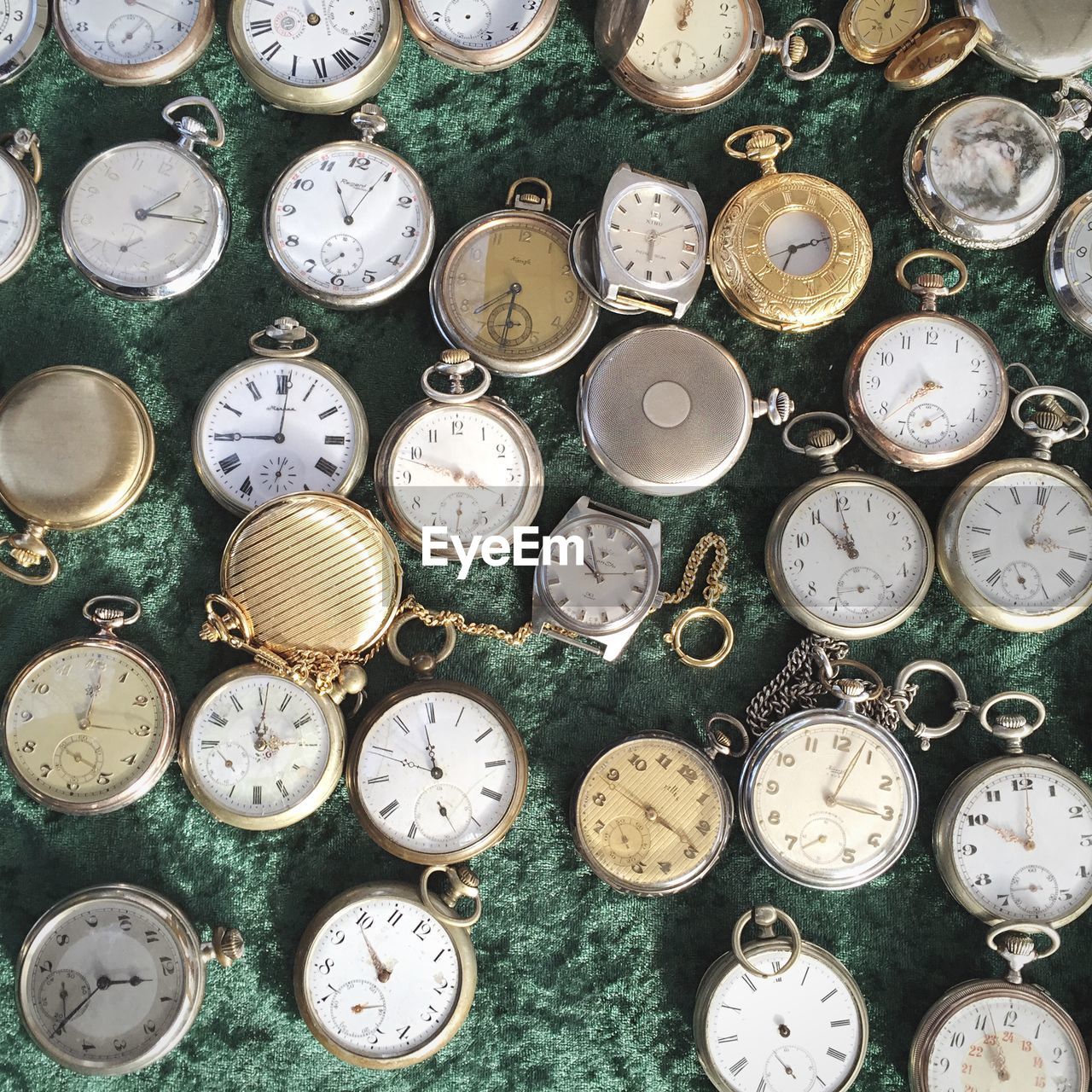 Directly above of old fashioned pocket watches in shop