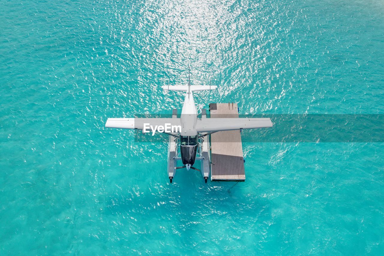 water, drone, sea, vehicle, nature, high angle view, seaplane, transportation, aircraft, day, blue, turquoise colored, outdoors, no people, aerial view, nautical vessel, travel, mode of transportation