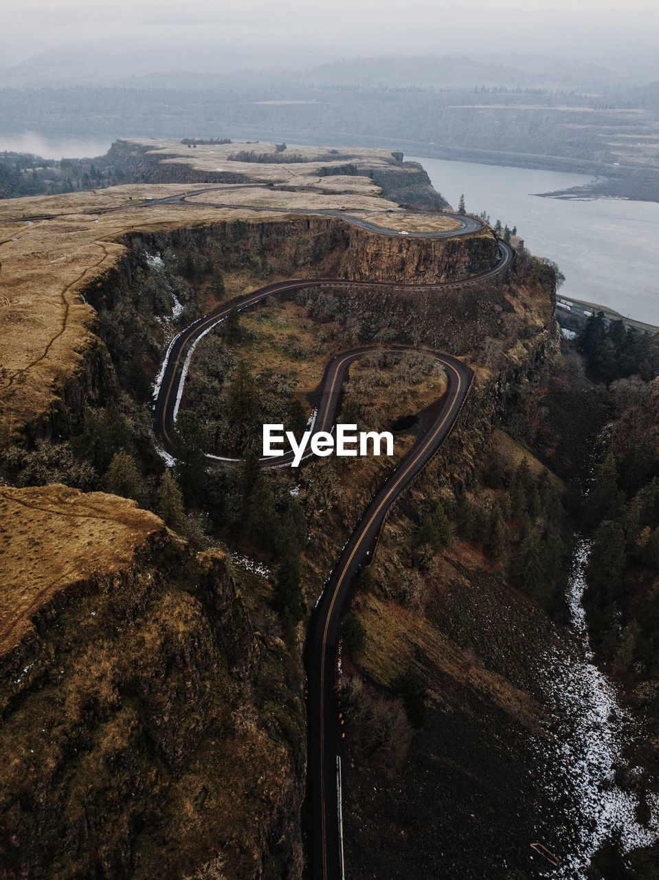 High angle view of road by river against sky