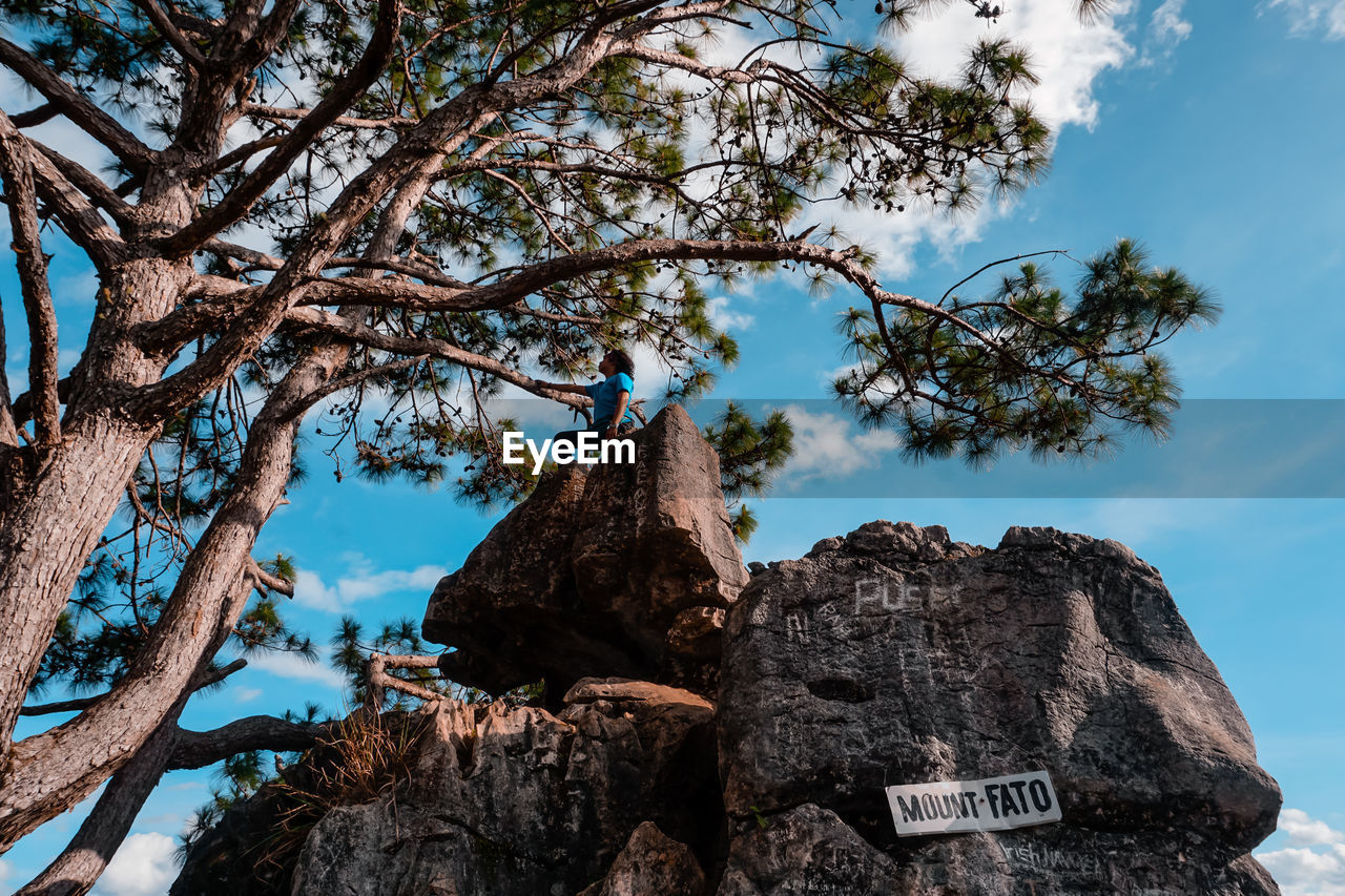 Low angle view of rock formation against sky